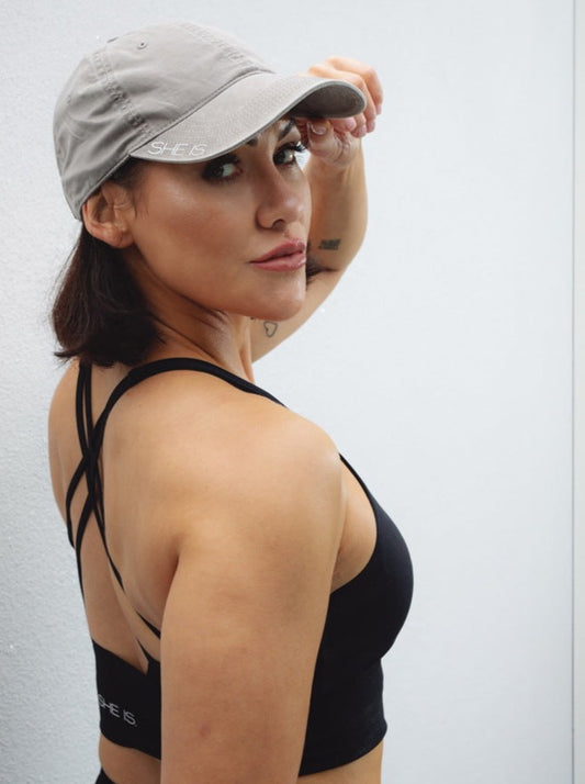 SHE IS. Cap